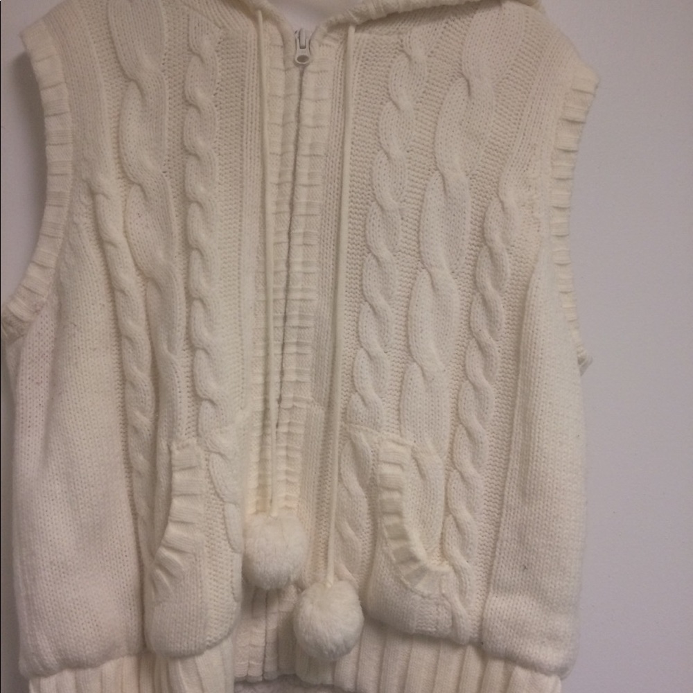 Cream colored “pom pom” sweater vest